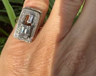 $3,250 - One 14kt yellow gold ladies diamond ring that contains one (1) emerald cut diamond that measures approx. 1.34 carats. Also one baguette cut diamond 0.16ct. The Diamonds are "G-H" in color and "VS2" in clarity. The ring weights 7.60 grams including the stones. combined weight of both stones 1.50 carats.