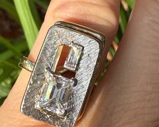$3,250 - One 14kt yellow gold ladies diamond ring that contains one (1) emerald cut diamond that measures approx. 1.34 carats. Also one baguette cut diamond 0.16ct. The Diamonds are "G-H" in color and "VS2" in clarity. The ring weights 7.60 grams including the stones. combined weight of both stones 1.50 carats.