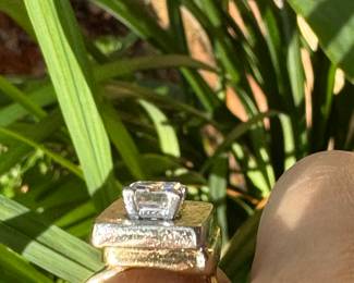 $3,250 - One 14kt yellow gold ladies diamond ring that contains one (1) emerald cut diamond that measures approx. 1.34 carats. Also one baguette cut diamond 0.16ct. The Diamonds are "G-H" in color and "VS2" in clarity. The ring weights 7.60 grams including the stones. combined weight of both stones 1.50 carats.
