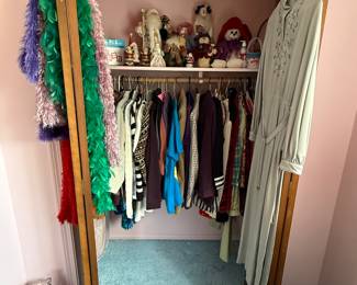 Here’s another closet of beautiful clothes above on the shelf are more Christmas items