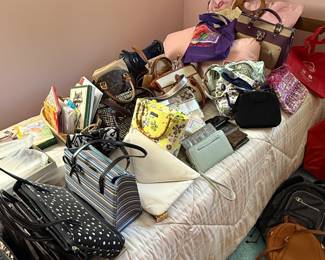 Turn I walk through we found a bed filled with purses of every shape imaginable