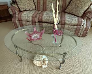 This is a lovely iron coffee table with a thick glass top!