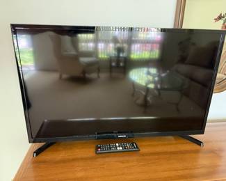 This is a very nice Samsung smart television with the remote and instructions