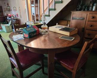 Solid Quarter-saw Oak oval Table w/ 2 leaves and 6 matching Chairs w/ red leather seats