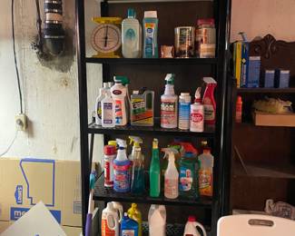 Coca-Cola metal shelf. Lots of Cleaning Supplies. Wheel Chair, shower chair, canes, etc.