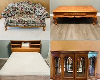 Vintage floral love seat, oak coffee table and bed. Small curio cabinet.