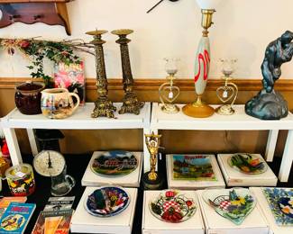 Candle holders, vintage kitchen scale and verity of Peggy Karr collectors plates.
