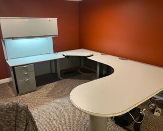 Steelcase wrap-around work station, crafting space, or whatever your needs may be. Corner piece is height adjustable. Includes overhead cabinet, light, pinboard, 3 drawer file cabinet.