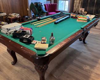 Custom walnut pool table, poker chips, card shufflers, dominoes, children’s games, not pictured,