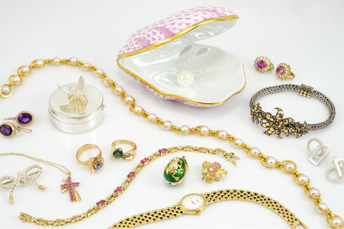 A small sample of some of the Fine Jewelry for sale, including: a 14k Gold Baume & Mercier Watch, a LE 18k There is incredible fine jewelry for sale, including exquisite pieces such as an 18k gold Fabergé egg pendant, a striking Tiffany & Co. 18k and sterling silver bow brooch, sterling Gucci earrings, and a dazzling Tiffany & Co. 18k gold bee adorned with diamonds and pink sapphires.