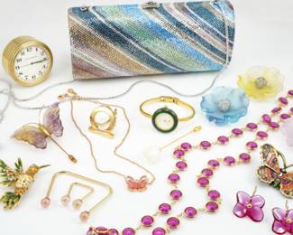 This small collection of incredible designer items includes, a Tiffany & Co. Clock, a Judith Leiber Handbag, a Vintage Gucci Ladies Watch, & Jewelry from Baccarat, Lalique, Swarovski, Jay Strongwater, Louis Vuitton, & Salvatore Ferragamo