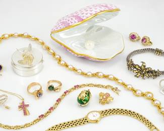 A small sample of some of the Fine Jewelry for sale, including: a 14k Gold Baume & Mercier Watch, a LE 18k There is incredible fine jewelry for sale, including exquisite pieces such as an 18k gold Fabergé egg pendant, a striking Tiffany & Co. 18k and sterling silver bow brooch, sterling Gucci earrings, and a dazzling Tiffany & Co. 18k gold bee adorned with diamonds and pink sapphires.