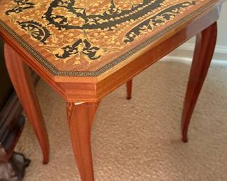 Inlaid table with hidden drawer
