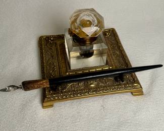 Antique brass inkwell and pen