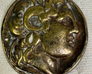 Brass coin paperweight from Greece