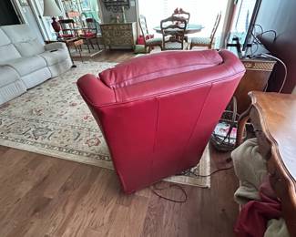 #59 red leather swivel electric recliner with adj head from Story and lee $850.00