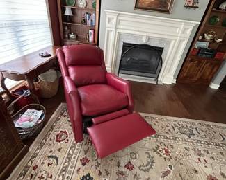 #59 red leather swivel electric recliner with adj head from Story and lee $850.00