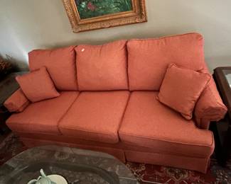 #41 Hide a bed coral sofa with attach back cushions 77 long $200.00