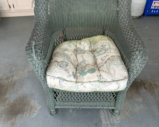 #103 green plastic wicker chair with cushion as is finish $40.00