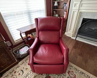 #59 red leather swivel electric recliner with adj head from Story and lee $850.00