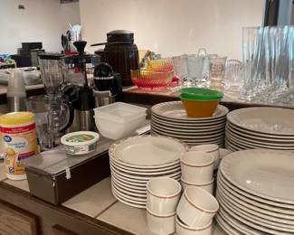 lots of bar ware and glasses everything you would need to entertain and have a full functioning bar