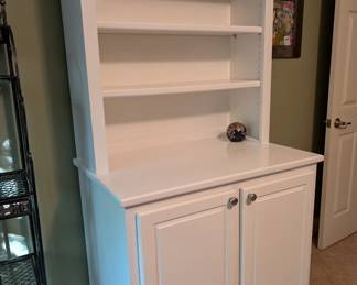 White storage cabinet with display shelf