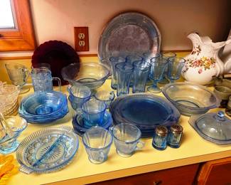 Blue depression glass dish set with other pieces too