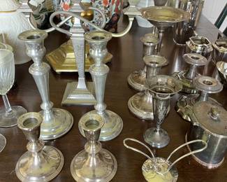 Selection of sterling silver and silverplate candlesticks.