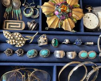 Interesting selection of vintage sterling silver jewelry and costume jewelry.