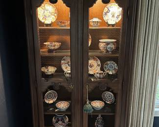 One of two impressive display cases/cabinets housing collections of Chinese Canton ware/porcelain, and Japanese Imari ware.