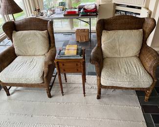 Pair of Baker Furniture “Milling Road” rattan wingback chairs.