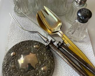 Sterling salt and pepper shakers, flatware, and more.