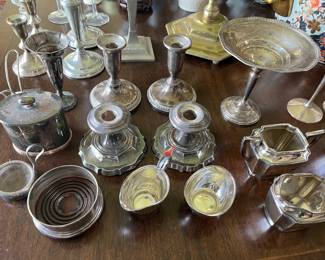 Selection of sterling silver and silverplate candlesticks, bowls, creamers/sugars, and more.