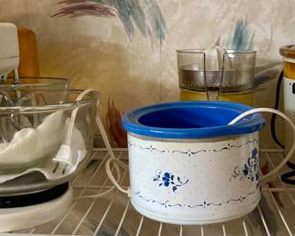 Assorted Selection of Kitchen Appliances and Crockpots.