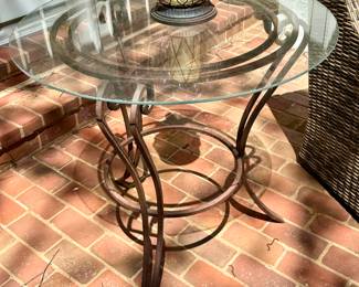 $80. Round metal base, glass top, great patina table! 31D, 31H.