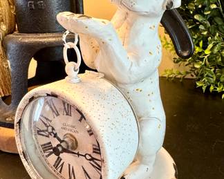 $50. Metal dog figuring with working clock. Battery operated. 8" H.