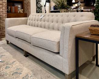 $850. La-Z-Boy sofa, 3 cushions, tufted back. Neutral color; could lean beige or grey. Sells new for $1800+. Very good condition! You must remove the legs to get it up the basement steps. 87 x 34 x 34H