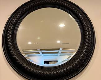 $200. Decorative round mirror, woven design on frame. Black color. 42"D.