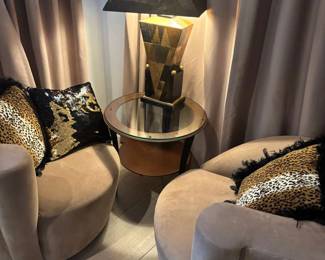 A Couple Cool Chairs and A Table and Lamp