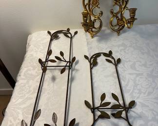 One pair of gold wall sconces and two burnished gold plate holders