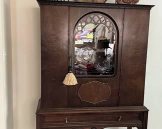 China Cabinet from Niemann Table Co. in Chicago. 5'5" high, two shelves (one glass and one wood with plate rail), 1920s, excellent condition.