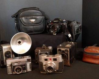 Vintage camera collection with cases and accessories