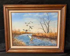 Original artwork depicting ducks in flight over a serene river landscape. Signed by the artist. Frame included. Year: 1981, Brand: Unknown, Model: Wildlife Art