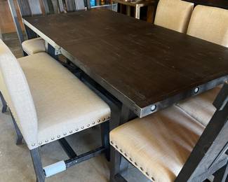 Beautiful black wooden table w/leaf and seating for eight including bench seat. Matching Buffet and TV. Console.