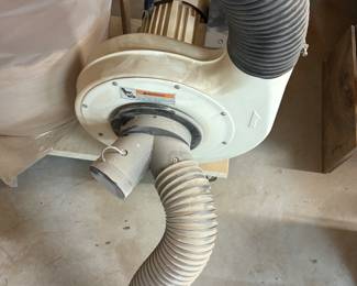 JET 1.5 HP Dust Dog dust collector with tubing on castors. $500.00