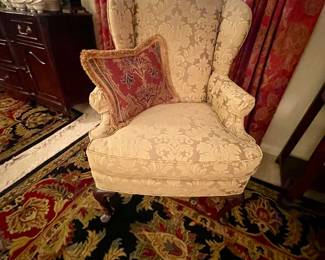 Upholstered wing back chair with designer pillow, gorgeous rugs