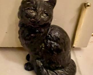 Cast iron cat door stopper