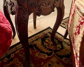 Detail of ornate wood side tables