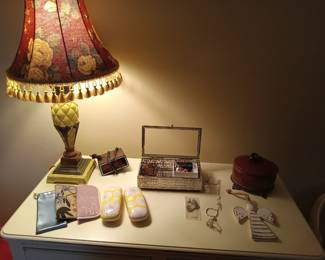 Lamp, mirrored jewelry box, glasses cases, costume jewelry.