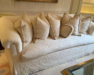 Upholstered skirted sofa